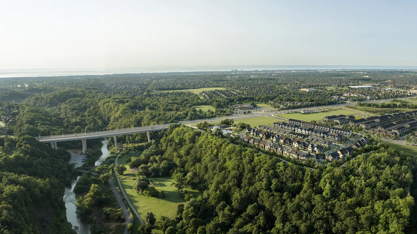 Aerial view of the Five Oaks townhomes beside the Sixteen Mile Creek valley and Lions Valley Park